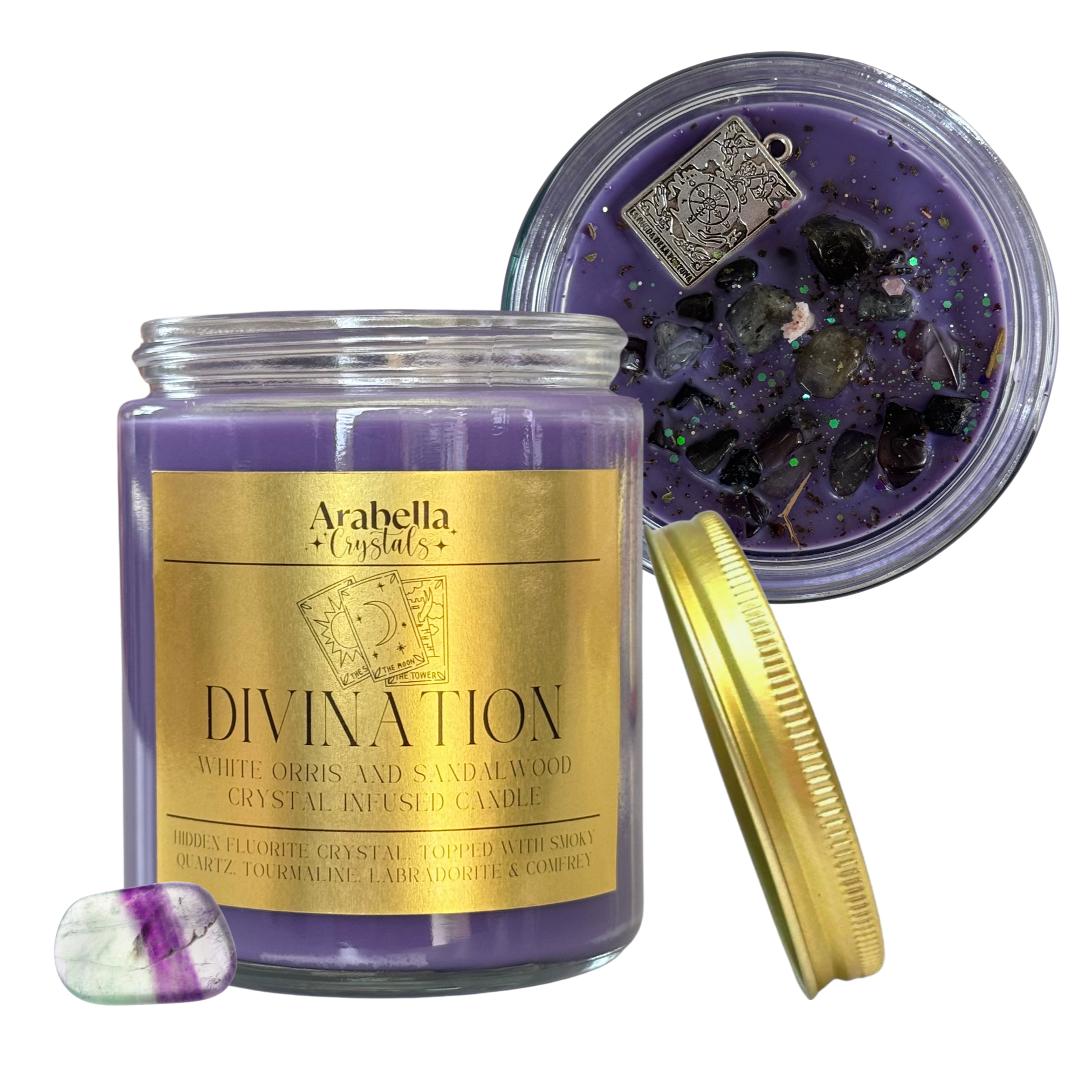 Purple candle with gold label and crystal-infused lid on a white background