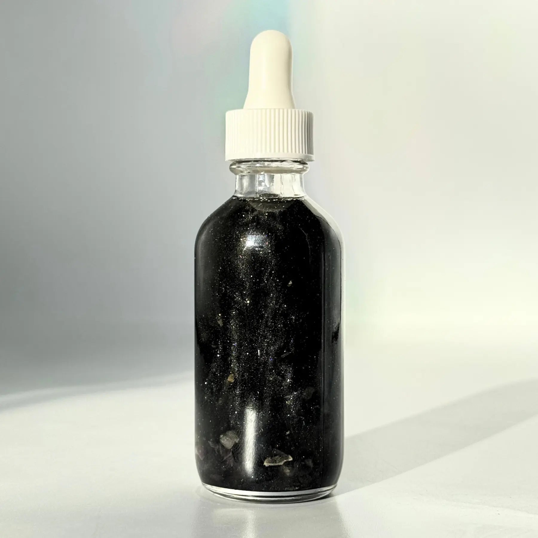 Black Magic Shimmer Oil Notes of: Incense, Dark Musk, Ylang Ylang