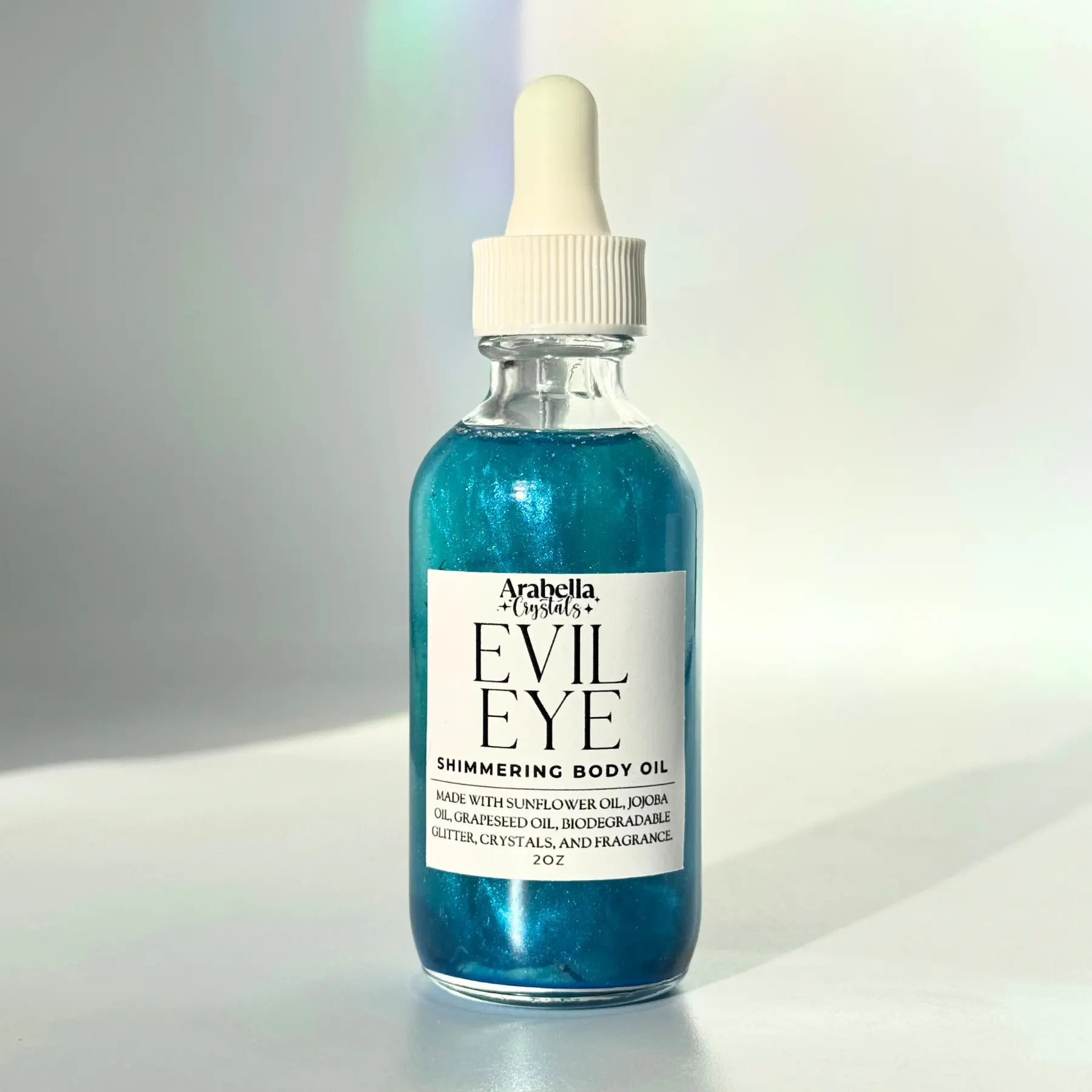 Evil Eye Shimmer Oil Notes of: Bergamot, Ylang Ylang, Amber, Musk