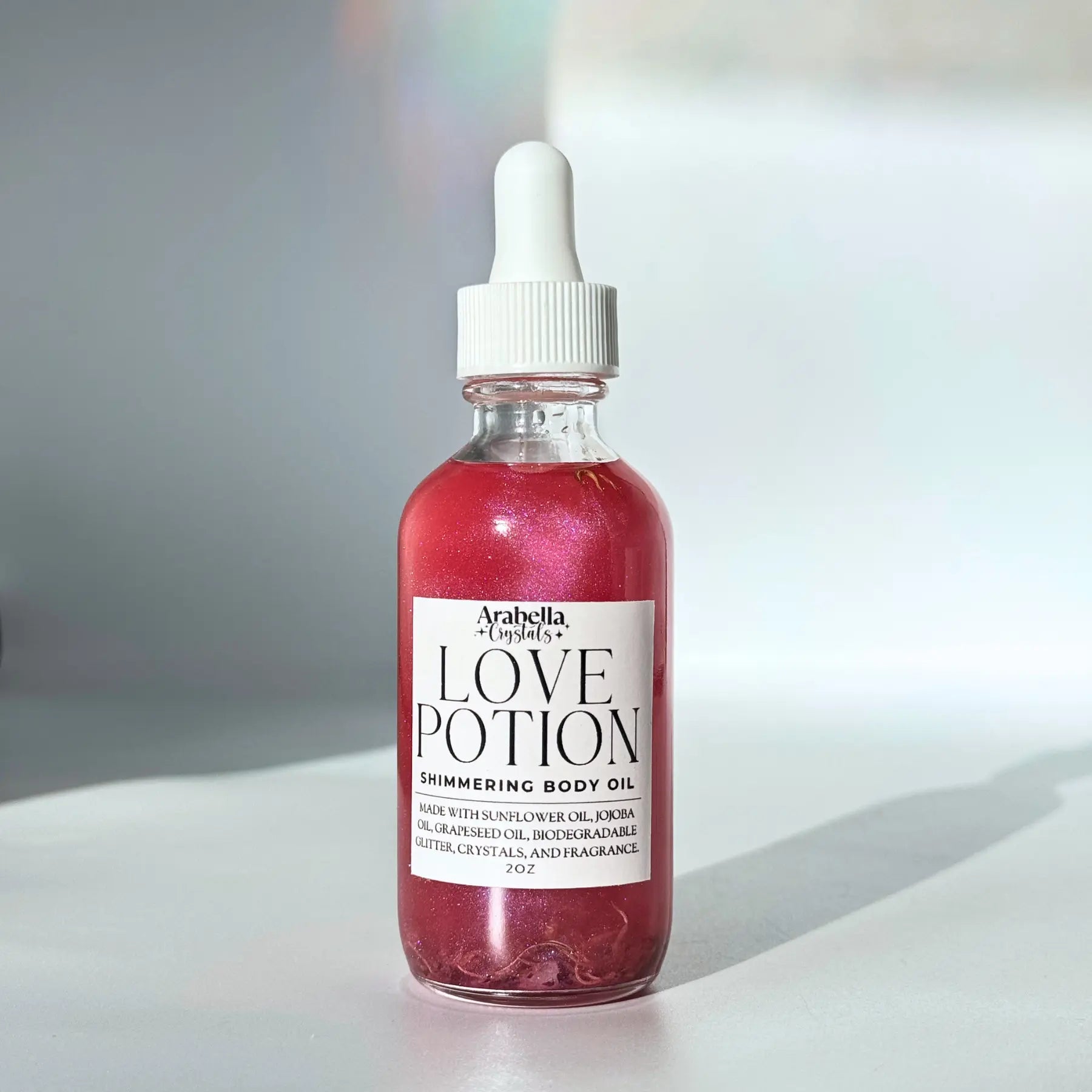 Love Potion Shimmer Oil Notes of: Plumeria, Jasmine, White Tea