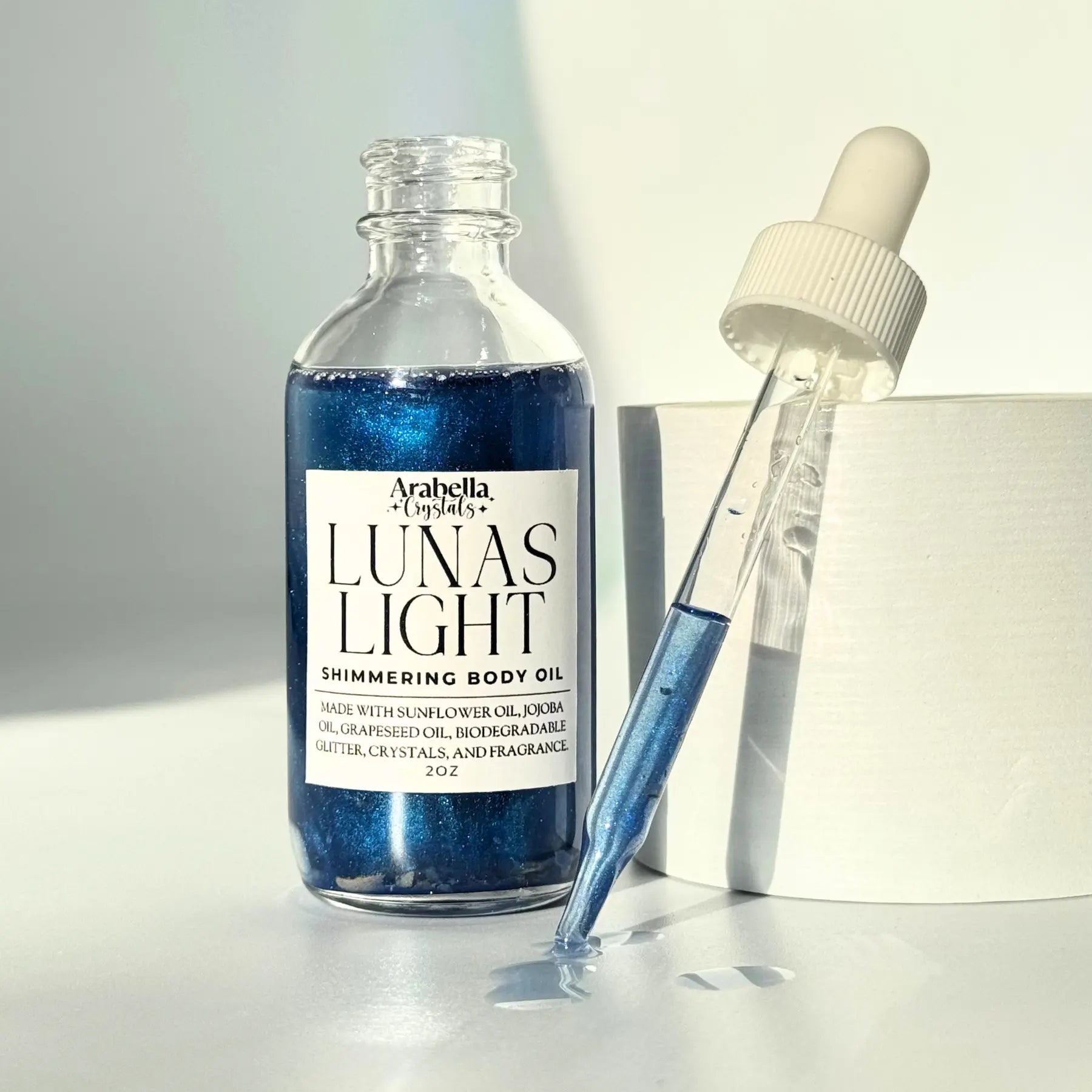Lunas Light Shimmer Oil Notes of: Eucalyptus, Violet, Musk