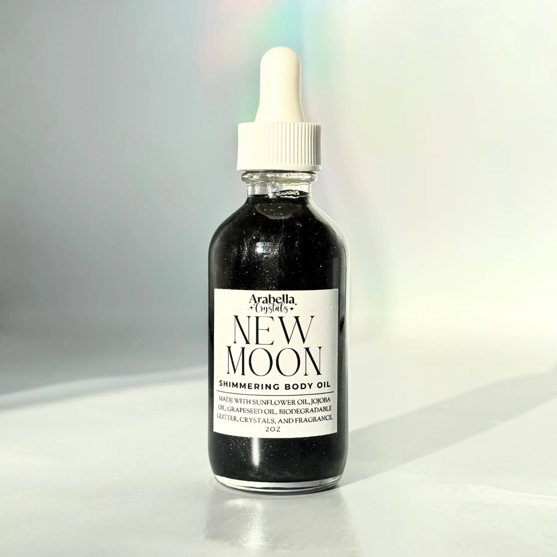 New Moon Shimmer Oil Notes of: Pear, Patchouli & Pine