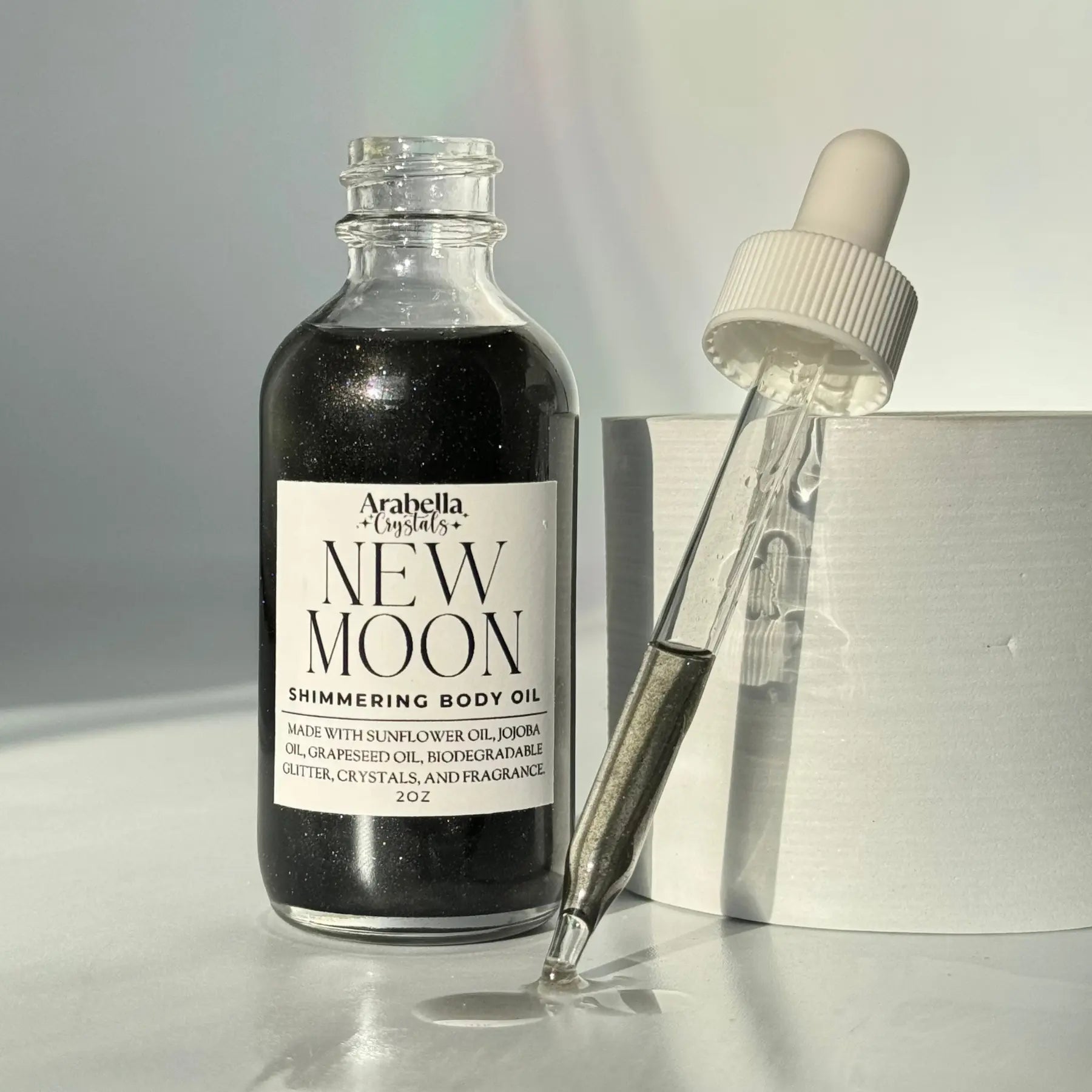 New Moon Shimmer Oil Notes of: Pear, Patchouli & Pine
